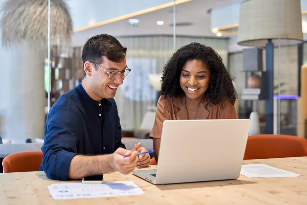 executive administrative assistant smiling and doing his job and also guiding a woman