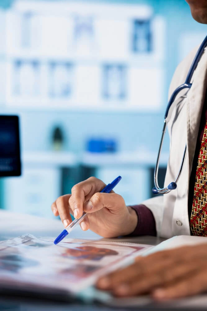 a physician with a pen in his hand