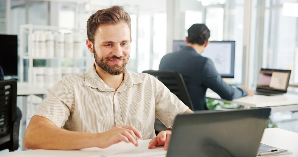 Skilled remote payroll assistant using cloud payroll software, hired via payroll recruitment agencies.