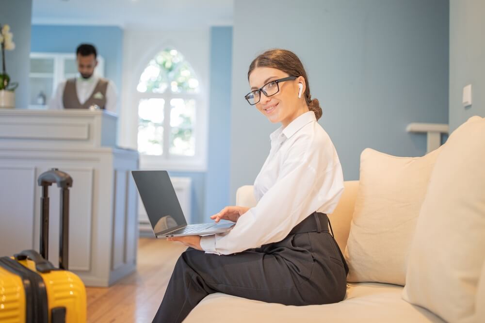 Virtual hospitality assistant managing hotel guest communication remotely