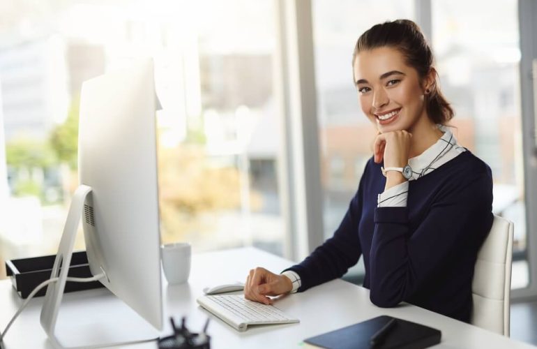 Professional virtual legal assistant handling legal documents and client communication using a laptop remotely.