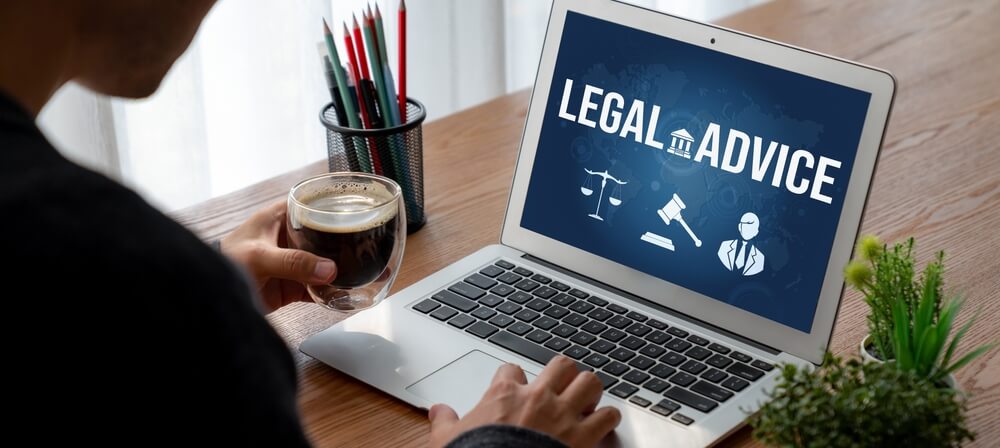 Attorney and virtual legal assistant communicating through video conferencing for legal support and case updates.