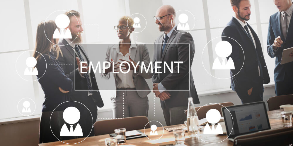 Recruiter discussing job opportunities with candidate in a staffing agency office