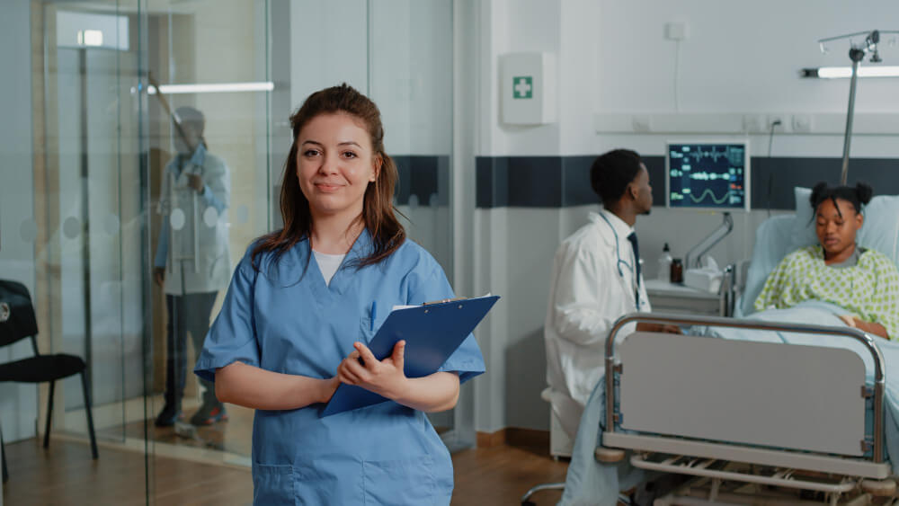 Physician assistant assisting surgeon during medical procedure in operating room