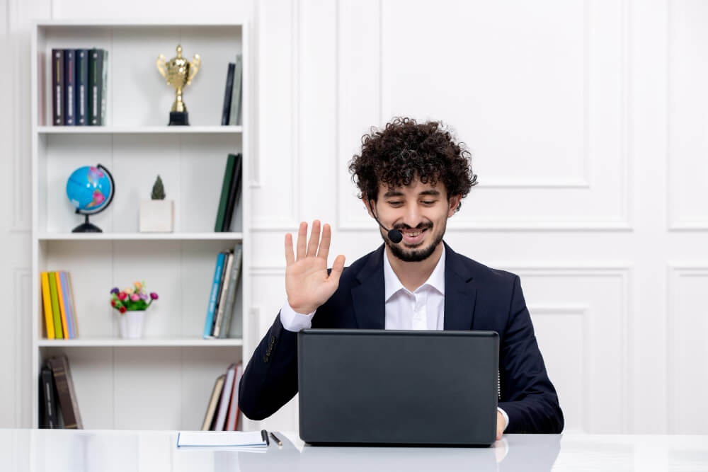 Professional working remotely on a laptop showing digital communication and online collaboration tools