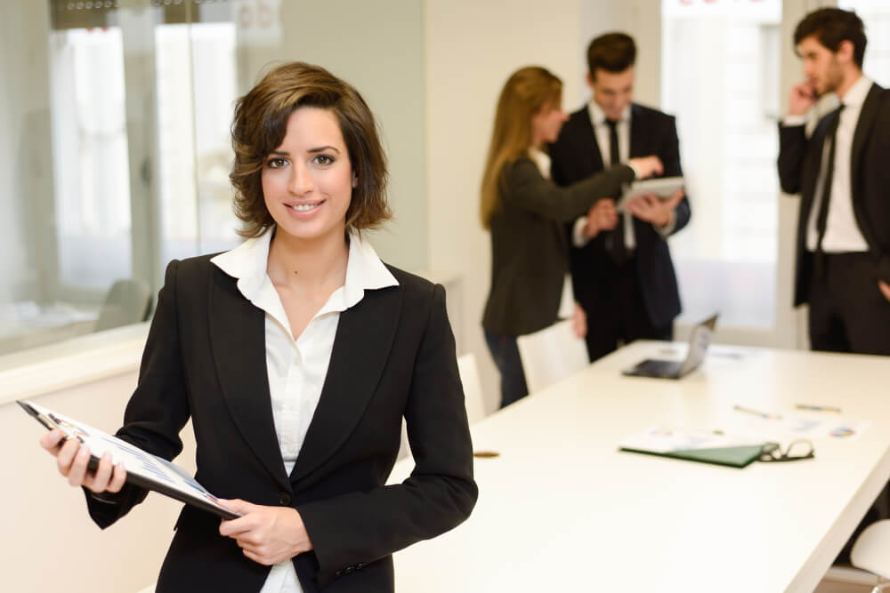 Paralegal reviewing case files, drafting legal documents, and assisting attorneys with legal research and preparation