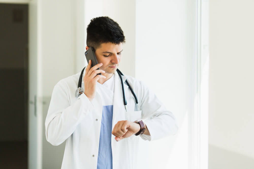 a doctor frustrated waiting for patient not appearing on schedule time