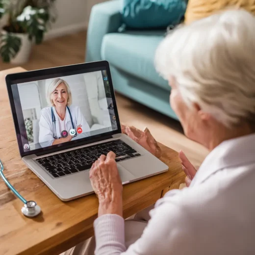 an old woman taking online session